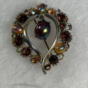 VTG Lisner faux Amber colored dangle cabochon brooch.